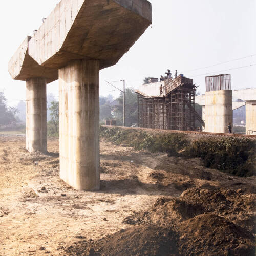 Color photograph landscape of an industrial area that looks abandoned.